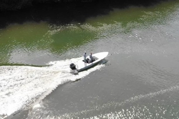 a man riding a surfboard in the water
