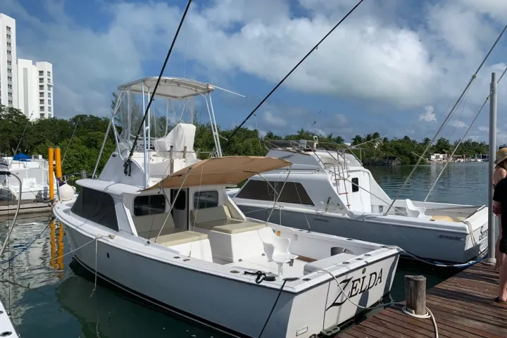 a boat is docked next to a body of water