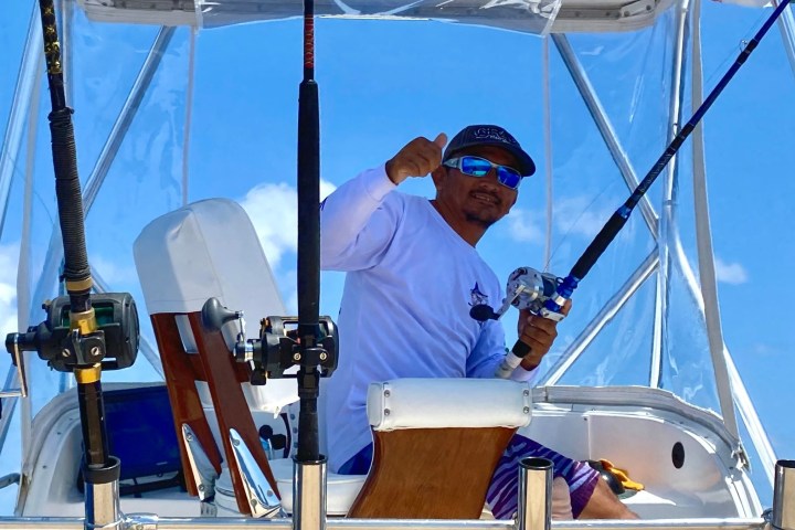 a man riding on the back of a boat