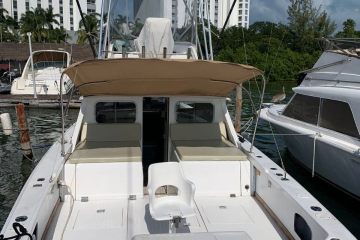 a boat sitting on top of a car