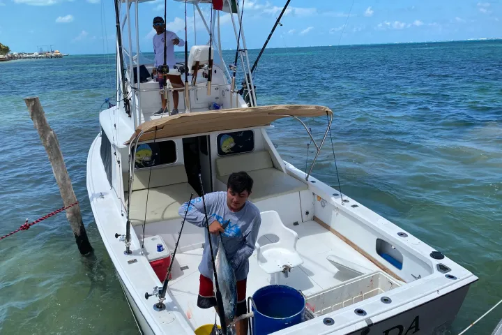 a man in a boat on a body of water