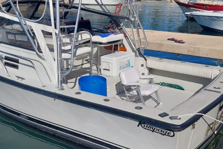 a boat is docked next to a body of water
