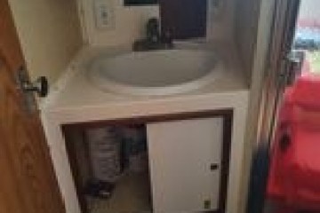 a close up of a sink in a small room