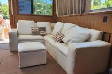 a living room filled with furniture and a large window