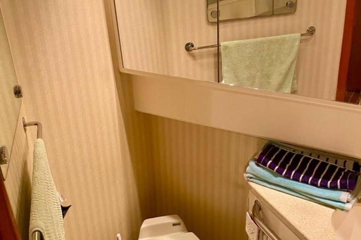 a room with a sink and a mirror