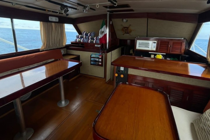 a bedroom with a desk and chair in a room