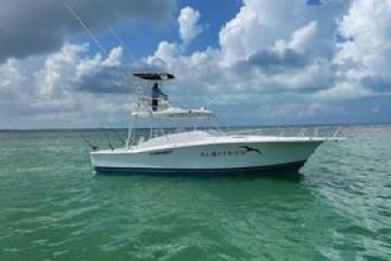 a small boat in a large body of water