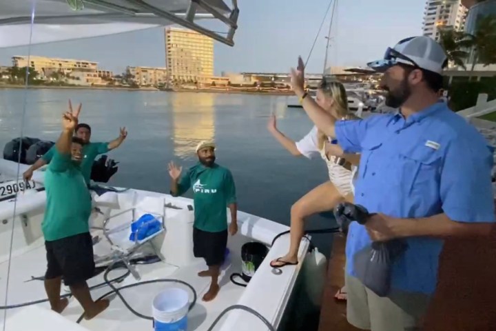 Clients waving goodbye after a Cancun Fishing Charter with Don Chingon Fishing Charters in Cancun.