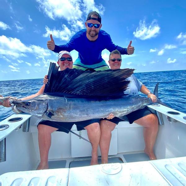 a man sitting in a boat on a body of water
