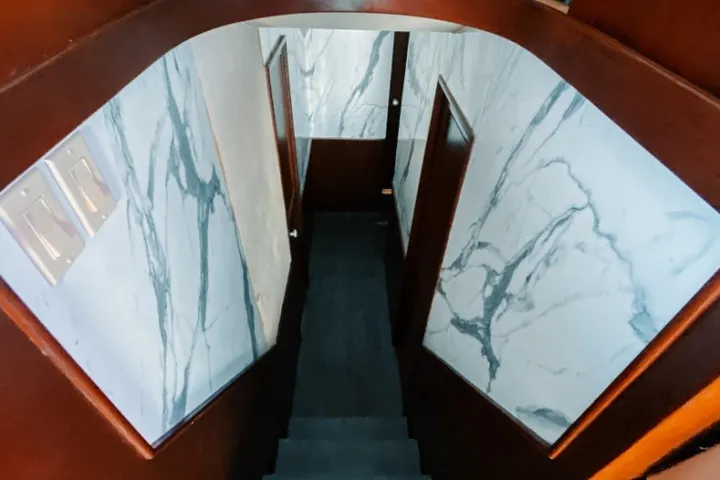 a stairway down to a few doors