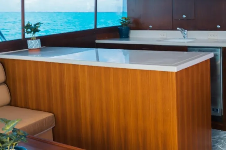 a kitchen with an island in the middle of a table