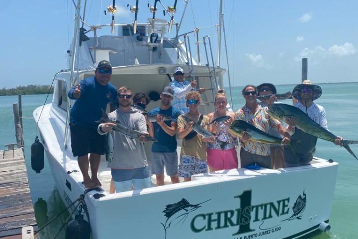 a group of people in a boat on a body of water