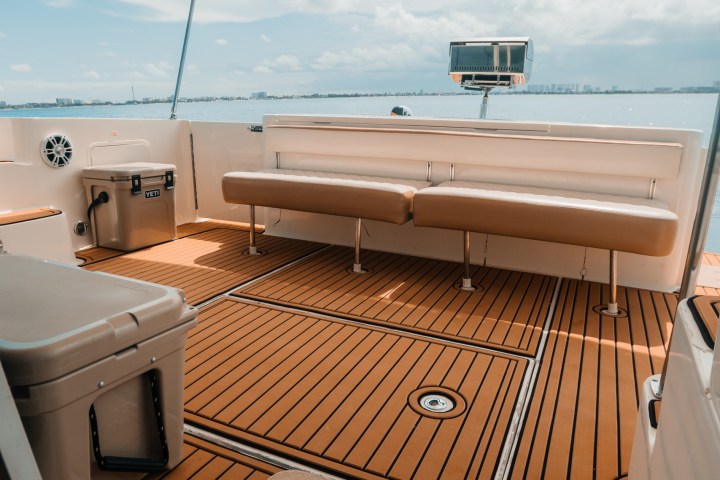 a bedroom with a bed and a chair in a room