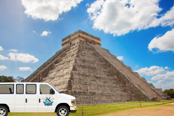 a bus parked in front of Chichen Itza
