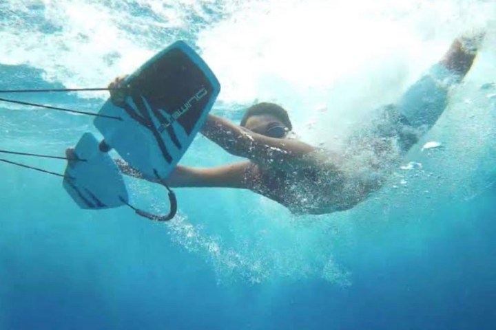 a man riding a wave on a surfboard in the water
